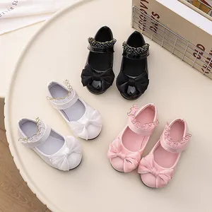 Girls patent leather Mary Jane shoes with large bow knot and ruffle strap details