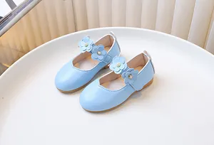 Detail of light blue girls Mary Jane shoes with 3D leather flowers and pearl accents
