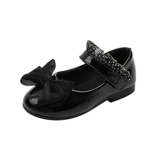 Girls black patent leather Mary Jane shoes with bow and polka dot ruffle trim
