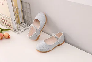 Detail of silver glitter Mary Jane shoes for girls with pearl rhinestone strap