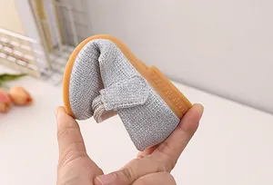 Macro shot of silver glitter baby shoe showing highly flexible and foldable rubber sole