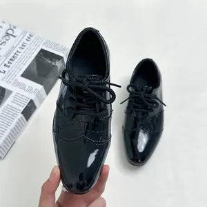 Classic boys black patent leather oxford shoes with textured crocodile embossing detail