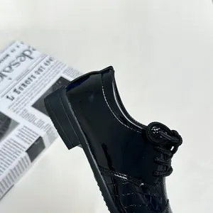 Classic black patent leather dress shoes for boys with stylish crocodile embossed texture
