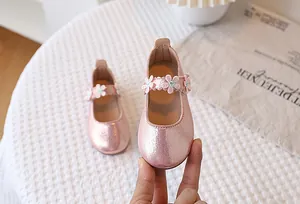 Pink glitter Mary Jane shoes for girls featuring a 3D embroidered floral detail