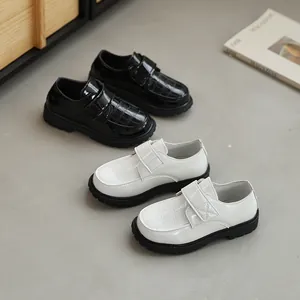 British style black and white patent leather boy shoes with crocodile pattern and velcro strap
