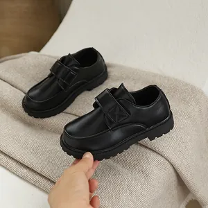 Classic black boys' school shoes with velcro strap and anti-slip rubber soles for boys