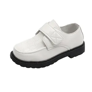 White formal patent leather boys shoes with crocodile pattern and velcro strap
