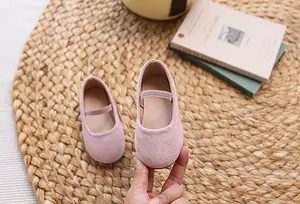 Detail view of pink suede Mary Jane flat shoes for girls with secure single strap