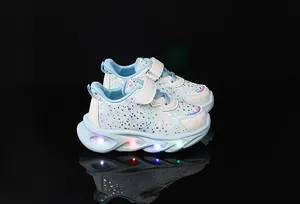 Detail view of girls LED light-up sneakers with glitter floral patterns and velcro straps