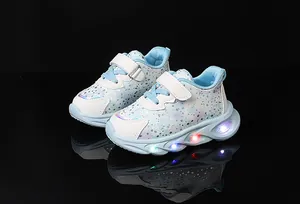 Detail of girls LED light-up sneakers with flower patterns and velcro strap closure