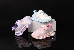 Three pairs of girls' LED light-up sneakers in pink, white, and purple with heart patterns