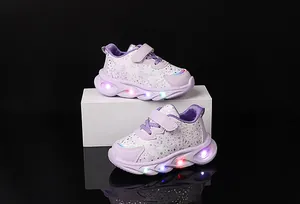 Detail of purple LED light-up sneakers for girls with floral patterns and velcro straps