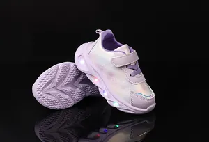 Detail of girls purple LED light up sneakers with iridescent heart print and velcro