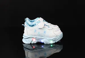 Detail view of girls butterfly sneakers with glowing LED soles and velcro straps