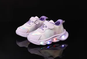 Close-up of purple girls sneakers featuring LED light-up soles and heart pattern detail