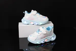 Close-up of girls' LED glowing sneakers with heart prints and light-up soles