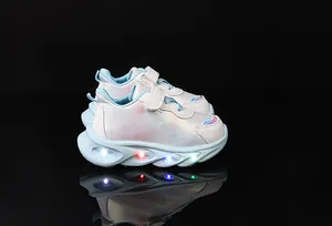 Detail of girls' LED light-up shoes with iridescent finish and reflective sole lights