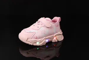 Pink LED light-up sneakers for girls featuring butterfly pattern and hook-and-loop straps