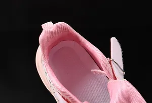 Detailed close-up of pink toddler sneaker interior padding and breathable mesh fabric