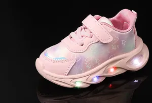 Detail of pink girls' LED light-up sneakers with heart prints and gradient mesh fabric