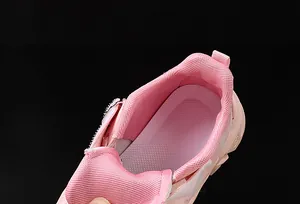 Close-up of breathable mesh lining and padded heel on pink cartoon girls' sneaker