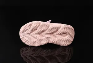 Pink girl's sneaker detail showing honeycomb anti-slip sole and size 23 engraving