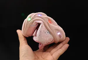 Close-up of pink toddler shoes showing high flexibility and colorful LED light-up soles