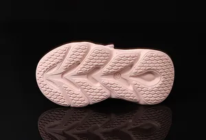 Detail of pink lightweight anti-slip sole with honeycomb pattern for kids' sneakers