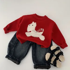 Red knit sweater with white puppy jacquard and blue jeans outfit for children