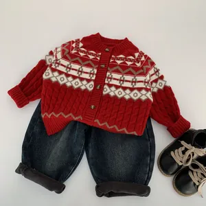 Red Fair Isle knit cardigan with dark denim jeans and black shoes for children's winter fashion