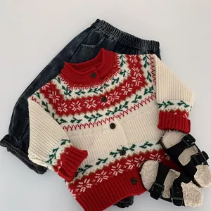 Close-up of children's festive knit cardigan with snowflake patterns and wooden buttons