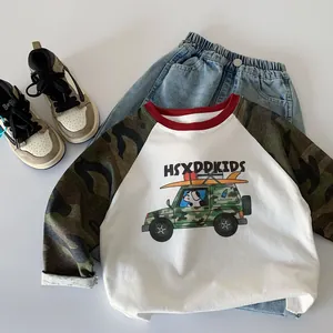 Detailed view of kids' long-sleeve tee with camouflage raglan sleeves and cartoon dog print