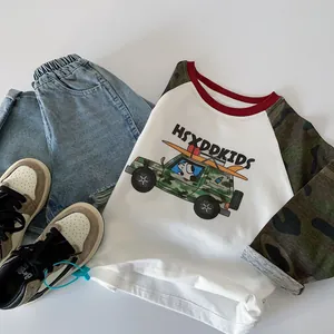 Kids long sleeve t-shirt and denim shorts set with sneakers in a flat lay view