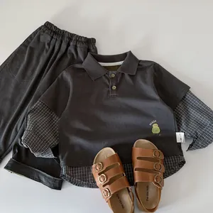 Toddler boy's polo set with dark grey layered shirt, shorts, and brown sandals set