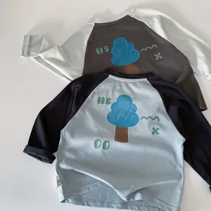 Detail of raglan long sleeve cotton t-shirts with cartoon tree prints for boys
