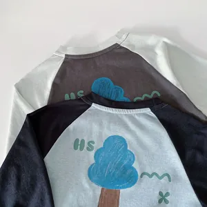 Detail view of cotton raglan long-sleeve T-shirts for boys with blue tree and HS prints