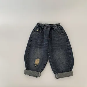 Kids trendy dark blue distressed denim jeans with elastic waist and rolled cuffs