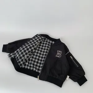 Boys black reversible bomber jacket with letter B embroidery and checkered lining