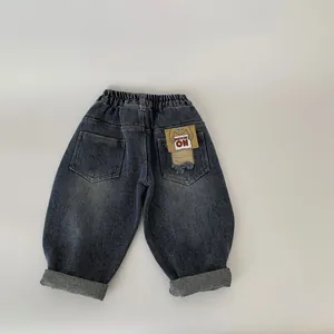 Kids vintage dark blue denim pants with elastic waist and stylish back pocket leather patch
