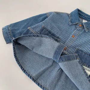 Classic blue wash denim shirt for boys featuring striped shoulder panels and brown buttons