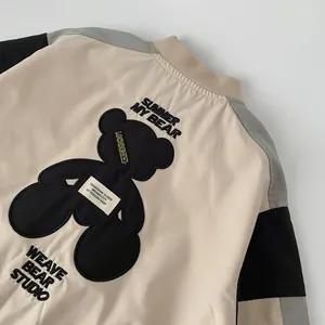 Boy's beige bear patchwork baseball jacket with embroidery detail on back