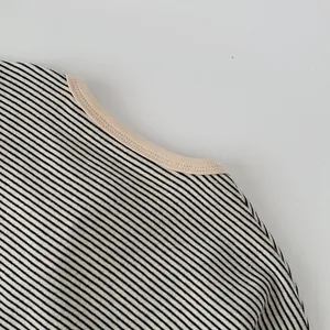 Detail shot of the contrast crew neck and striped texture on kids casual t-shirt