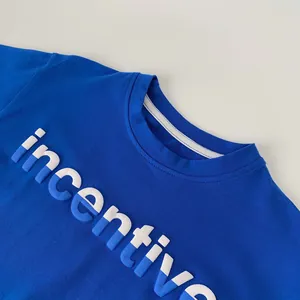 Detail of the high-quality blue boy's t-shirt showing the puffy 3D letter print design