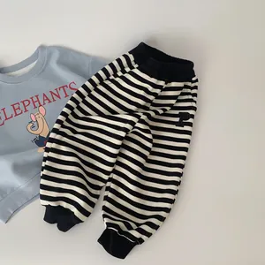 Toddler boy spring outfit with light blue elephant sweatshirt and striped jogger pants