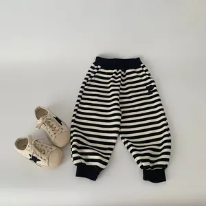 Classic black and white striped cotton joggers for boys with elastic waist and P-patch
