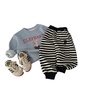 Three-piece boys' spring outfit with blue elephant sweatshirt, striped pants and sneakers