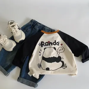 Detail of kids raglan sleeve panda t-shirt and washed denim jeans set on white background