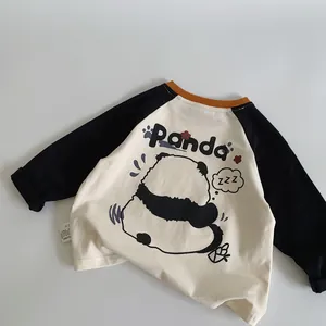 Detail of raglan sleeve kids T-shirt with cute panda print and fabric care label
