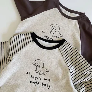 Detailed close-up of cotton long sleeve kids t-shirts with cute dog print and embroidery