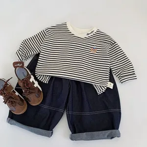 Striped long sleeve kids T-shirt with bear embroidery and navy wide-leg jeans outfit